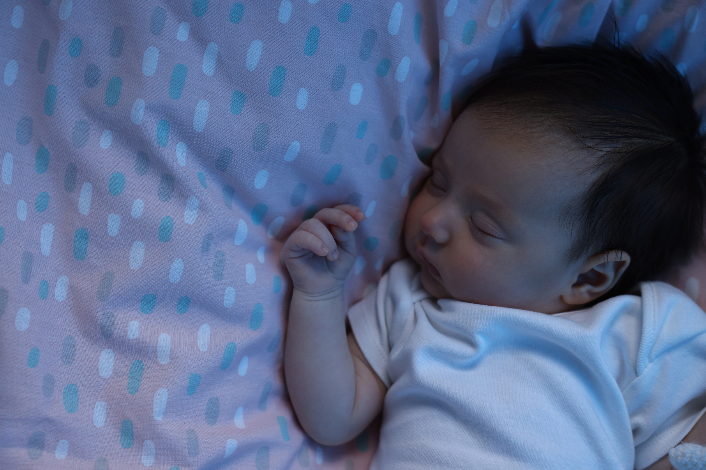 Baby stirring quietly during nighttime sleep
