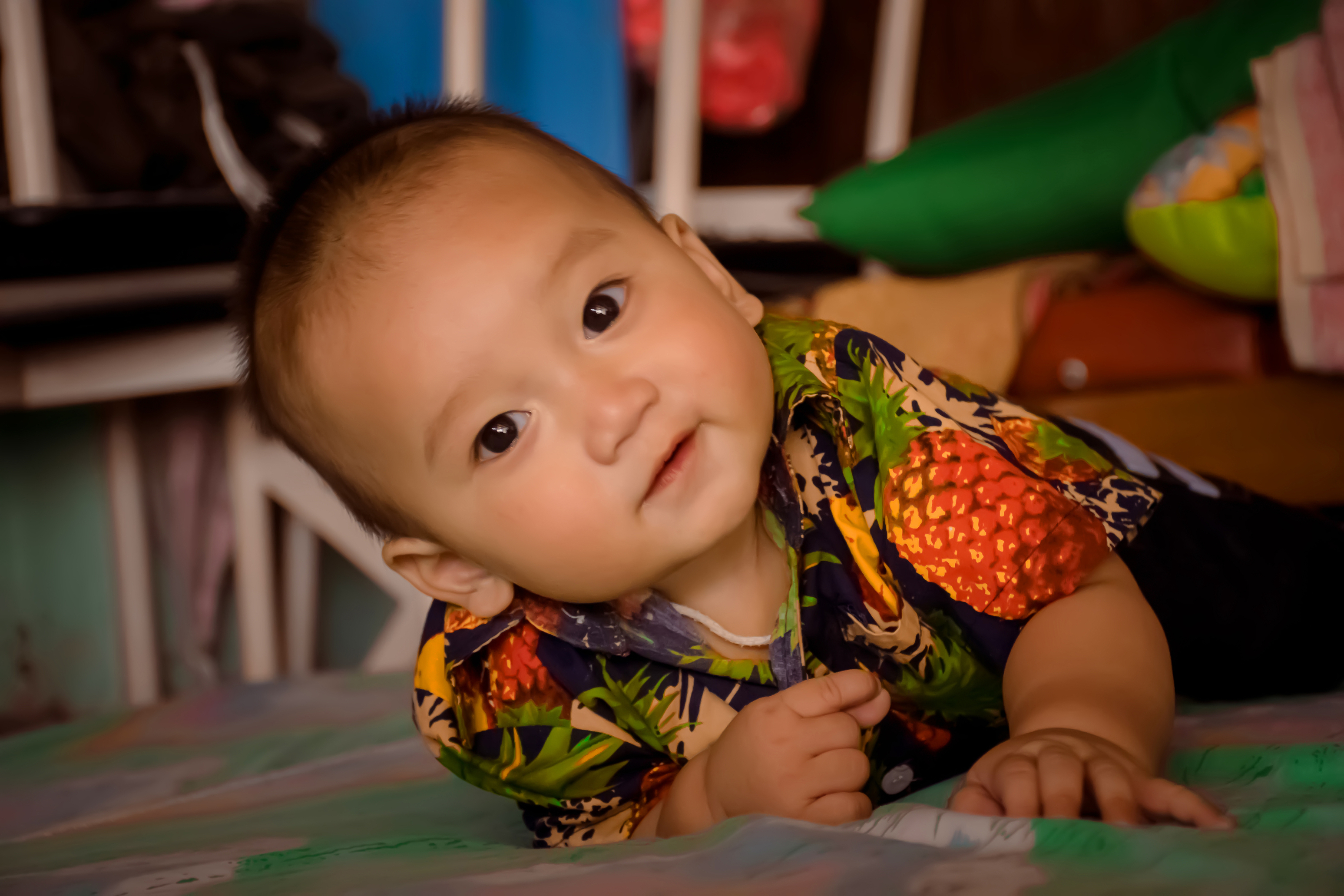 Baby practicing rolling during supervised floor play