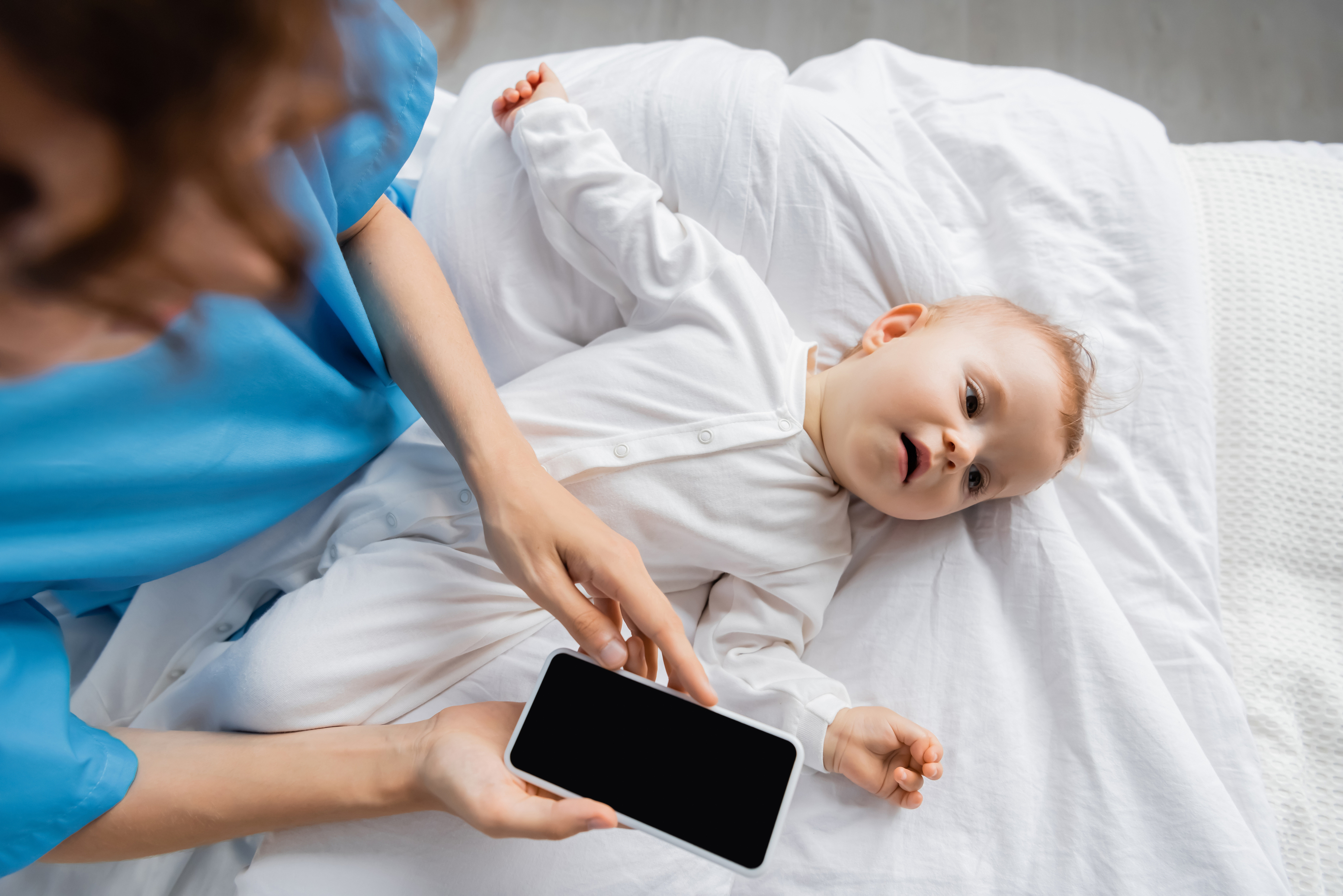 Sleep tracking notes beside a crib monitor