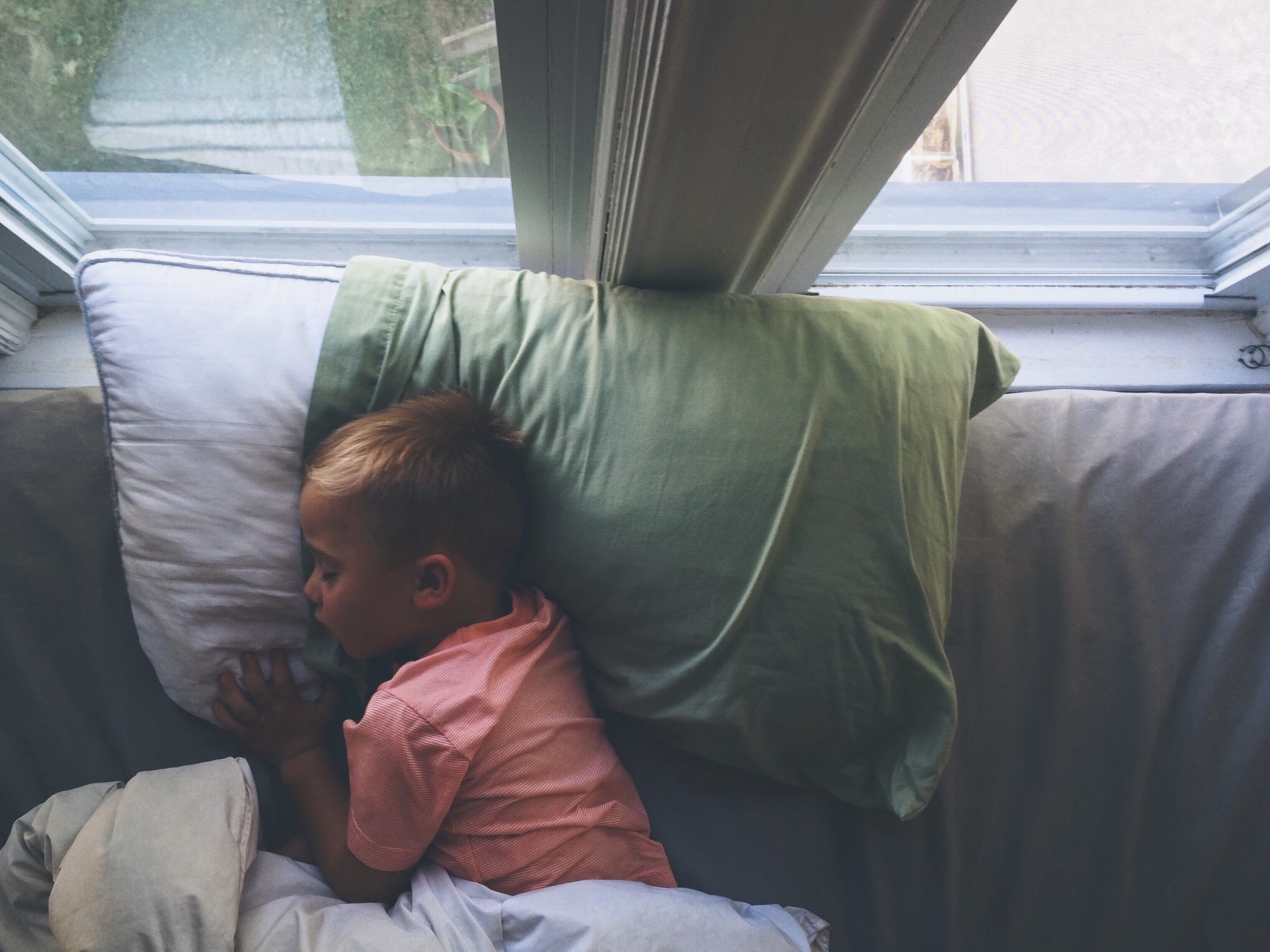 Toddler resting during a midday nap