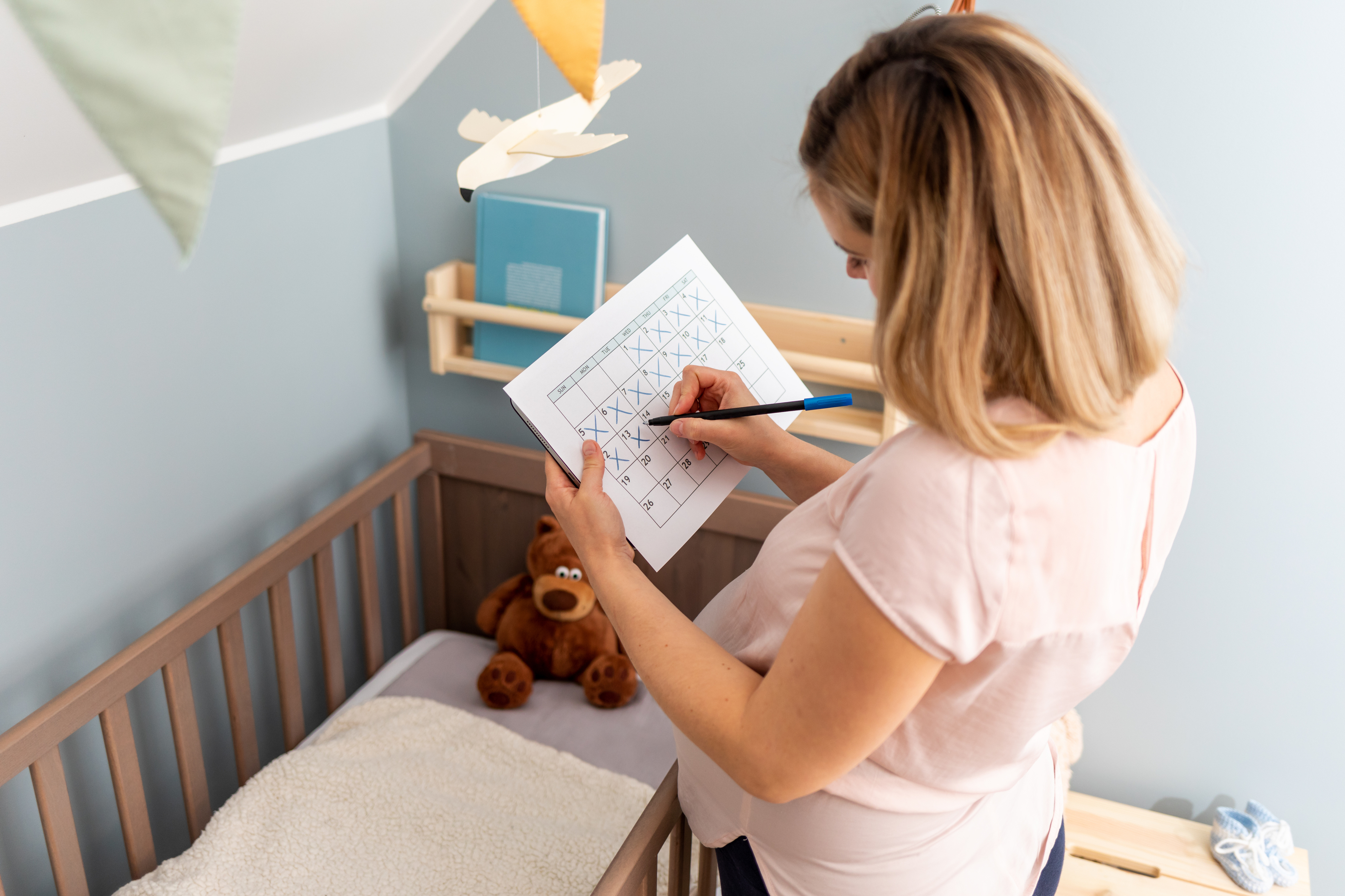 Caregiver reviewing toddler nap and bedtime patterns