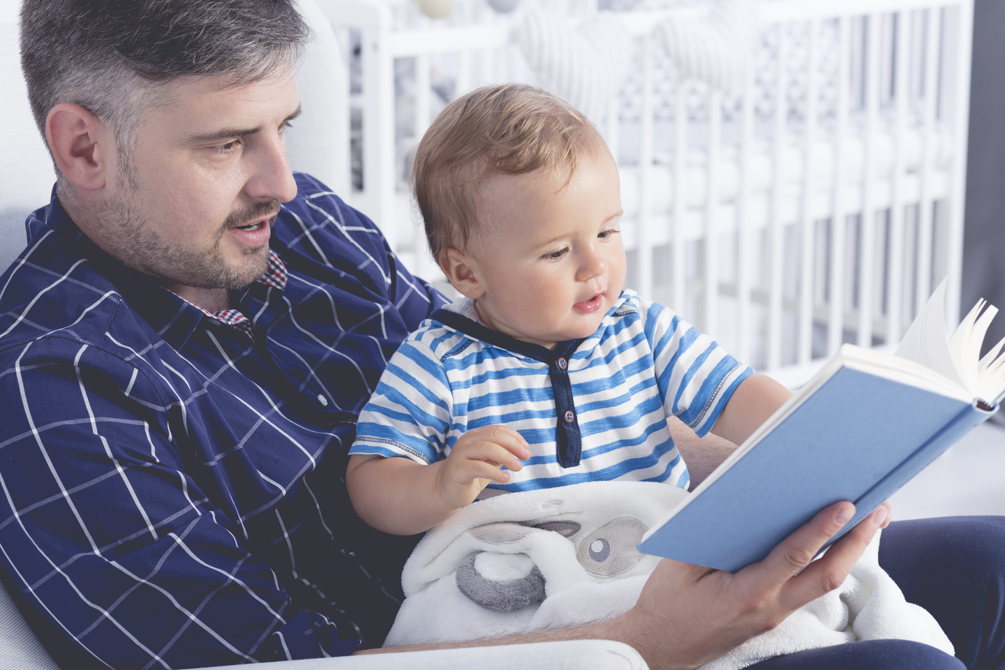 Calm bedtime routine with parent reading to baby